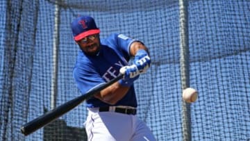 Mar 28, 2015; Surprise, AZ, USA; Seattle Seahawks quarterback Russell Wilson takes batting practice with the Texas Rangers on the practice fields at Surprise Stadium. Mandatory Credit: Mark J. Rebilas-USA TODAY Sports
