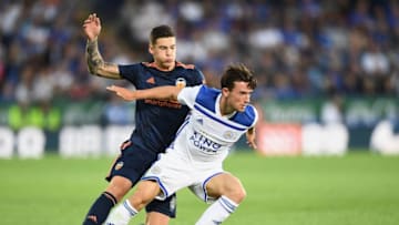 LEICESTER, ENGLAND - AUGUST 01: Ben Chilwell of Leiceter City is challenged by Santi Mina of Valencia during the pre-season friendly match between Leicester City and Valencia at The King Power Stadium on August 1, 2018 in Leicester, England. (Photo by Clive Mason/Getty Images)