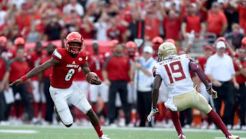 LOUISVILLE, KY - SEPTEMBER 17: Lamar Jackson #8 of the Louisville Cardinals runs past A.J. Westerbrook #19 of the Florida State Seminoles duriing the fourth quarter of the game at Papa John's Cardinal Stadium on September 17, 2016 in Louisville, Kentucky. (Photo by Bobby Ellis/Getty Images)