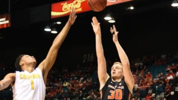 March 10, 2016; Las Vegas, NV, USA; Oregon State Beavers forward Olaf Schaftenaar (30) shoots the basketball against California Golden Bears forward Ivan Rabb (1) during the first half of the Pac-12 Conference tournament at MGM Grand Garden Arena. Mandatory Credit: Kyle Terada-USA TODAY Sports