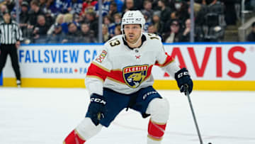 Mar 27, 2022; Toronto, Ontario, CAN; Florida Panthers forward Sam Reinhart (13) looks for the puck against the Toronto Maple Leafs at Scotiabank Arena. Mandatory Credit: John E. Sokolowski-USA TODAY Sports