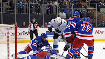 NEW YORK, NEW YORK - DECEMBER 03: Igor Shesterkin #31 of the New York Rangers is injured during this third period pileup against the San Jose Sharks at Madison Square Garden on December 03, 2021 in New York City. The Rangers shutout the Sharks 1-0. (Photo by Bruce Bennett/Getty Images)