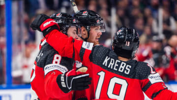 TAMPERE, FINLAND - MAY 28: Lawson Crouse of Canada (C) celebrated by Cody Glass of Canada (L) and Peyton Krebs of Canada (R) for his goal during the 2023 IIHF Ice Hockey World Championship Finland - Latvia game between Canada and Germany at Nokia Arena on May 28, 2023 in Tampere, Finland. (Photo by Jari Pestelacci/Eurasia Sport Images/Getty Images)
