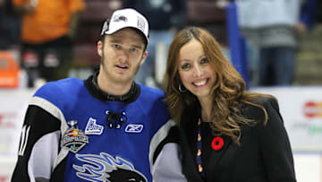 MISSISSAUGA, CANADA - MAY 29: Mastercard's Lillian Tomovich presents the Stafford Smythe Memorial MVP Trophy to Jonathan Huberdeau