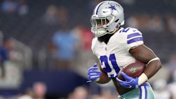 ARLINGTON, TX - AUGUST 19: Ezekiel Elliott #21 of the Dallas Cowboys carries the ball during pregame warm-up before the Dallas Cowboys take on the Indianapolis Colts in a Preseason game at AT&T Stadium on August 19, 2017 in Arlington, Texas. (Photo by Tom Pennington/Getty Images)