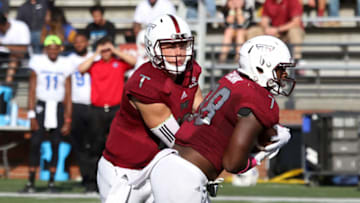 October 15, 2016: Troy Trojans running back Jordan Chunn (38) takes a handoff from Troy Trojans quarterback Brandon Silvers (12) duirng the game between the Georgia State Panthers and the Troy Trojans. Troy defeated Georgia State by the score of 31-21 at Veterans Memorial Stadium in Troy, Alabama. (Photo by Michael Wade/Icon Sportswire via Getty Images)