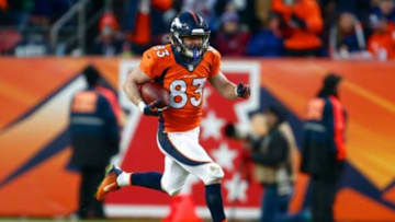 Dec 28, 2014; Denver, CO, USA; Denver Broncos wide receiver Wes Welker (83) runs the ball in the fourth quarter against the Oakland Raiders at Sports Authority Field at Mile High. The Broncos defeated the Raiders 47-14. Mandatory Credit: Isaiah J. Downing-USA TODAY Sports