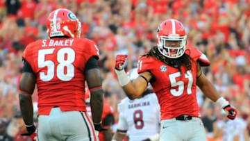 Sep 7, 2013; Athens, GA, USA; Georgia Bulldogs linebacker Ramik Wilson (51) reacts with defensive end Sterling Bailey (58) after a goal line stand against the South Carolina Gamecocks during the second half at Sanford Stadium. Georgia defeated South Carolina 41-30. Mandatory Credit: Dale Zanine-USA TODAY Sports