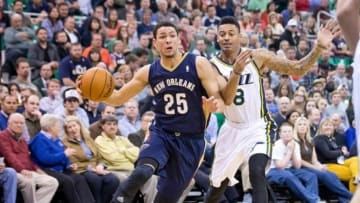 Nov 13, 2013; Salt Lake City, UT, USA; New Orleans Pelicans shooting guard Austin Rivers (25) dribbles around Utah Jazz guard Diante Garrett (8) during the second half at EnergySolutions Arena. The Jazz won 111-105. Mandatory Credit: Russ Isabella-USA TODAY Sports