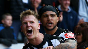 NEWCASTLE UPON TYNE, ENGLAND - APRIL 15: Matt Ritchie of Newcastle United celebrates after scoring his sides second goal with Deandre Yedlin of Newcastle United during the Premier League match between Newcastle United and Arsenal at St. James Park on April 15, 2018 in Newcastle upon Tyne, England. (Photo by Alex Livesey/Getty Images)