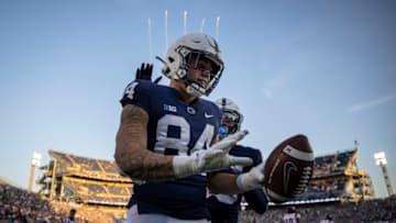 STATE COLLEGE, PA - SEPTEMBER 11: Theo Johnson #84 of the Penn State Nittany Lions celebrates after scoring a touchdown against the Ball State Cardinals during the second half at Beaver Stadium on September 11, 2021 in State College, Pennsylvania. (Photo by Scott Taetsch/Getty Images)