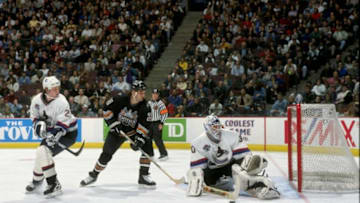 VANCOUVER - MARCH 28: Left wing Craig Berube of the Washington Capitals tries to get past defenseman Bryan McCabe and goaltender Garth Snow #30 of the Vancouver Canucks during a game on March 28, 1998 at the G.M. Place in Vancouver, B.C., Canada. The Capitals defeated the Canucks 3-2. (Photo by Craig Melvin/Getty Images)
