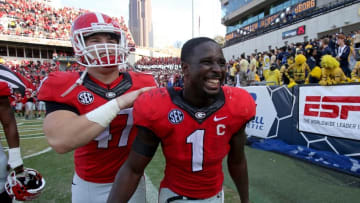 Nov 28, 2015; Atlanta, GA, USA; Georgia Bulldogs running back Sony Michel (1) celebrates fullback Christian Payne (47) after their game against the Georgia Tech Yellow Jackets at Bobby Dodd Stadium. The Bulldogs won 13-7. Mandatory Credit: Jason Getz-USA TODAY Sports
