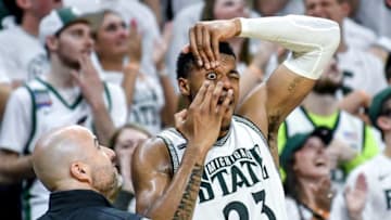 Michigan State's Xavier Tillman replaces a contact lens on the bench during the second half on Sunday, March 8, 2020, at the Breslin Center in East Lansing.