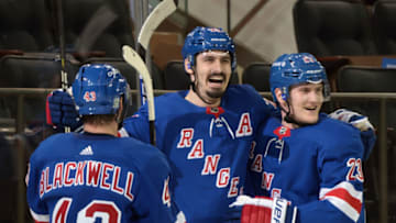 Feb 26, 2021; New York, New York, USA; Colin Blackwell #43, Chris Kreider #20 and Adam Fox #23 of the New York Rangers celebrate Kreider's second period goal against the Boston Bruins at Madison Square Garden. Mandatory Credit: POOL PHOTOS-USA TODAY Sports