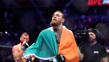 January 18, 2020; Las Vegas, Nevada, USA; Conor McGregor holds an Irish flag as he celebrates his first round TKO victory against Donald Cerrone following UFC 246 at T-Mobile Arena. Mandatory Credit: Mark J. Rebilas-USA TODAY Sports