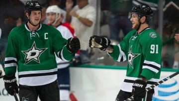 Sep 29, 2014; Dallas, TX, USA; Dallas Stars center Tyler Seguin (91) and left wing Jamie Benn (14) celebrate Seguins third goal against the Florida Panthers during the third period at the American Airlines Center. Seguin has a hat trick in the game. The Stars defeated the Panthers 5-4. Mandatory Credit: Jerome Miron-USA TODAY Sports