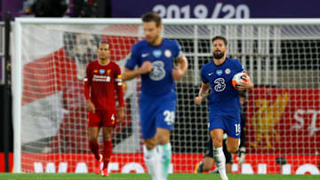 LIVERPOOL, ENGLAND - JULY 22: Olivier Giroud of Chelsea takes the ball back to centre after scoring his team's first goal during the Premier League match between Liverpool FC and Chelsea FC at Anfield on July 22, 2020 in Liverpool, England. Football Stadiums around Europe remain empty due to the Coronavirus Pandemic as Government social distancing laws prohibit fans inside venues resulting in all fixtures being played behind closed doors. (Photo by Phil Noble/Pool via Getty Images)