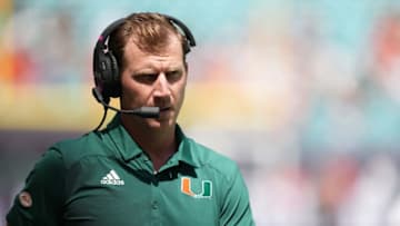 Sep 18, 2021; Miami Gardens, Florida, USA; Miami Hurricanes offensive coordinator Rhett Lashlee walks on the sidelines prior to the game against the Michigan State Spartans at Hard Rock Stadium. Mandatory Credit: Jasen Vinlove-USA TODAY Sports
