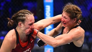 DALLAS, TX - SEPTEMBER 08: (R-L) Irene Aldana of Mexico punches Lucie Pudilova of Czech Republic in their women's bantamweight fight during the UFC 228 event at American Airlines Center on September 8, 2018 in Dallas, Texas. (Photo by Josh Hedges/Zuffa LLC/Zuffa LLC via Getty Images)