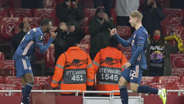 LONDON, ENGLAND - DECEMBER 03: (BILD ZEITUNG OUT) Emile Smith Rowe of Arsenal and Ainsley Maitland-Niles of Arsenal celebrates after scoring his teams fourth goal during the UEFA Europa League Group B stage match between Arsenal FC and Rapid Wien at Emirates Stadium on December 3, 2020 in London, United Kingdom. Sporting stadiums around the UK remain under strict restrictions due to the Coronavirus Pandemic as Government social distancing laws prohibit fans inside venues resulting in games being played behind closed doors. (Photo by Vincent Mignott/DeFodi Images via Getty Images)