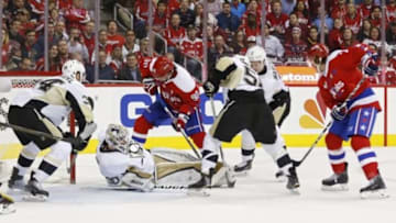 Mar 1, 2016; Washington, DC, USA; Pittsburgh Penguins goalie Matt Murray (30) makes a save on Washington Capitals center Marcus Johansson (90) in the first period at Verizon Center. Mandatory Credit: Geoff Burke-USA TODAY Sports
