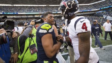 Oct 29, 2017; Seattle, WA, USA; Seattle Seahawks quarterback Russell Wilson (3) embraces Houston Texans quarterback Deshaun Watson (4) after a game at CenturyLink Field. The Seahawks won 41-38. Mandatory Credit: Troy Wayrynen-USA TODAY Sports