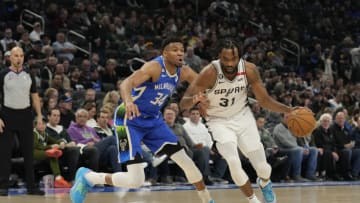 MILWAUKEE, WISCONSIN - MARCH 22: Keita Bates-Diop #31 of the San Antonio Spurs drives against Giannis Antetokounmpo #34 of the Milwaukee Bucks during the second half at Fiserv Forum on March 22, 2023 in Milwaukee, Wisconsin. NOTE TO USER: User expressly acknowledges and agrees that, by downloading and or using this photograph, user is consenting to the terms and conditions of the Getty Images License Agreement. (Photo by Patrick McDermott/Getty Images)