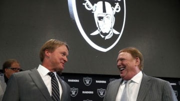 ALAMEDA, CA - JANUARY 09: Oakland Raiders new head coach Jon Gruden (L) talks with Raiders owner Mark Davis during a news conference at Oakland Raiders headquarters on January 9, 2018 in Alameda, California. Jon Gruden has returned to the Oakland Raiders after leaving the team in 2001. (Photo by Justin Sullivan/Getty Images)