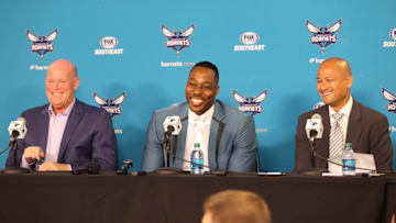 CHARLOTTE, NC- JUNE 26: Rich Cho and Steve Clifford introduce Dwight Howard