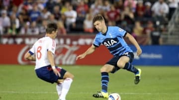 Jul 29, 2015; Denver, CO, USA; Tottenham Hotspur defender Ben Davies (33) controls the ball against MLS All Star midfielder Ethan Finlay (8) of Columbus Crew SC during the second half of the 2015 MLS All Star Game at Dick