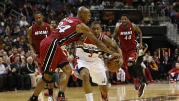 Jan 15, 2014; Washington, DC, USA; Miami Heat shooting guard Ray Allen (34) fouls Washington Wizards shooting guard Bradley Beal (3) while dribbling the ball in the second quarter at Verizon Center. Mandatory Credit: Geoff Burke-USA TODAY Sports
