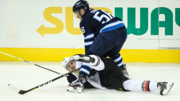 WINNIPEG, MB September 27: Ottawa Senators defenseman Mark Borowiecki (74) is checked by Winnipeg Jets forward Marko Dano (56) during the NHL game between the Winnipeg Jets and the Ottawa Senators on September 27, 2017 at the Bell MTS Place in Winnipeg MB. (Photo by Terrence Lee/Icon Sportswire via Getty Images)
