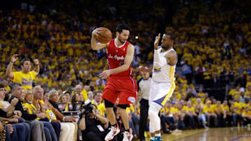 OAKLAND, CA - MAY 01: J.J. Redick #4 of the Los Angeles Clippers saves the ball from going out of bounds by throwing it off of Andre Iguodala #9 of the Golden State Warriors in Game Six of the Western Conference Quarterfinals during the 2014 NBA Playoffs at ORACLE Arena on May 1, 2014 in Oakland, California. NOTE TO USER: User expressly acknowledges and agrees that, by downloading and or using this photograph, User is consenting to the terms and conditions of the Getty Images License Agreement. (Photo by Ezra Shaw/Getty Images)