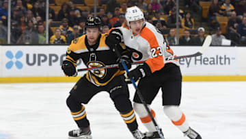 BOSTON, MA - OCTOBER 25: Matt Grezlcyk #43 of the Boston Bruins against Oskar Linblom #23 of the Philadelphia Flyers at the TD Garden on October 25, 2018 in Boston, Massachusetts. (Photo by Steve Babineau/NHLI via Getty Images)