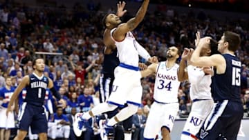 Mar 26, 2016; Louisville, KY, USA; Kansas Jayhawks guard Frank Mason III (0) shoots the ball against Villanova Wildcats guard Ryan Arcidiacono (15) during the second half of the south regional final of the NCAA Tournament at KFC YUM!. Mandatory Credit: Aaron Doster-USA TODAY Sports