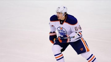 Jan 27, 2014; Vancouver, British Columbia, CAN; Edmonton Oilers forward Nail Yakupov (64) skates against the Vancouver Canucks during the second period at Rogers Arena. The Edmonton Oilers won 4-2. Mandatory Credit: Anne-Marie Sorvin-USA TODAY Sports
