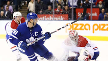 Carey Price #31 of the Montreal Canadiens makes a glove save on John Tavares #91 of the Toronto Maple Leafs. (Photo by Vaughn Ridley/Getty Images)
