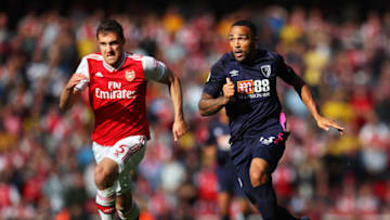 LONDON, ENGLAND - OCTOBER 06: Sokratis Papastathopoulos of Arsenal runs with the ball with pressure from Callum Wilson of AFC Bournemouth during the Premier League match between Arsenal FC and AFC Bournemouth at Emirates Stadium on October 06, 2019 in London, United Kingdom. (Photo by Catherine Ivill/Getty Images)