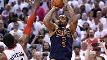 May 23, 2016; Toronto, Ontario, CAN; Cleveland Cavaliers forward J.R. Smith (5) takes a jump shot past the arm of Toronto Raptors forward Patrick Patterson (54) in game four of the Eastern conference finals of the NBA Playoffs at Air Canada Centre. Mandatory Credit: Dan Hamilton-USA TODAY Sports