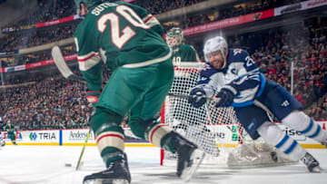 ST. PAUL, MN - JANUARY 13: Ryan Suter #20 of the Minnesota Wild controls the puck with Blake Wheeler #26 of the Winnipeg Jets defending during the game at the Xcel Energy Center on January 13, 2018 in St. Paul, Minnesota. (Photo by Bruce Kluckhohn/NHLI via Getty Images)