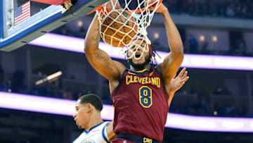 SAN FRANCISCO, CALIFORNIA - JANUARY 09: Lamar Stevens #8 of the Cleveland Cavaliers slam dunks over Juan Toscano-Anderson #95 of the Golden State Warriors during the first quarter at Chase Center on January 09, 2022 in San Francisco, California. NOTE TO USER: User expressly acknowledges and agrees that, by downloading and or using this photograph, User is consenting to the terms and conditions of the Getty Images License Agreement. (Photo by Thearon W. Henderson/Getty Images)