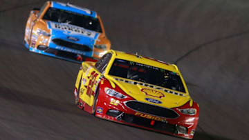 SPARTA, KY - JULY 08: Joey Logano, driver of the #22 Shell Pennzoil/Autotrader Ford, leads Danica Patrick, driver of the #10 Nature's Bakery/Feeding America Ford (Photo by Matt Sullivan/Getty Images)