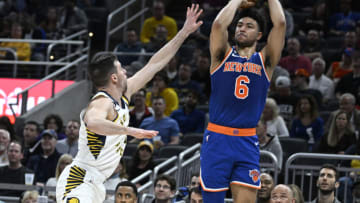 Apr 5, 2023; Indianapolis, Indiana, USA; New York Knicks guard Quentin Grimes (6) shoots over Indiana Pacers guard T.J. McConnell (9) during the first half at Gainbridge Fieldhouse. Mandatory Credit: Marc Lebryk-USA TODAY Sports
