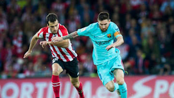 BILBAO, SPAIN - OCTOBER 28: Lionel Messi of FC Barcelona competes for the ball with Inigo Lekue of Athletic Club during the La Liga match between Athletic Club Bilbao and FC Barcelona at San Mames Stadium on October 28, 2017 in Bilbao, Spain. (Photo by Juan Manuel Serrano Arce/Getty Images)