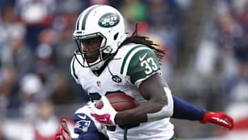 Oct 25, 2015; Foxborough, MA, USA; New York Jets running back Chris Ivory (33) runs the ball against New England Patriots outside linebacker Jamie Collins (91) during the second half at Gillette Stadium. Mandatory Credit: Mark L. Baer-USA TODAY Sports