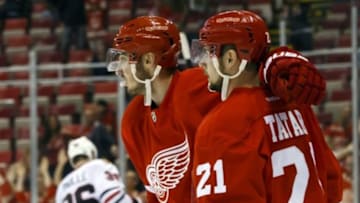 Sep 23, 2015; Detroit, MI, USA; Detroit Red Wings left wing Tomas Tatar (21) receives congratulations from right wing Tomas Jurco (26) after scoring in the third period against the Chicago Blackhawks at Joe Louis Arena. Detroit won 4-1. Mandatory Credit: Rick Osentoski-USA TODAY Sports
