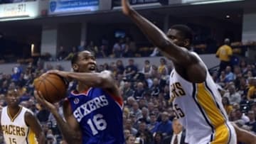 Oct 29, 2014; Indianapolis, IN, USA; Philadelphia 76ers forward Chris Johnson (16) goes up for a shot against Indiana Pacers center Roy Hibbert (55) at Bankers Life Fieldhouse. Mandatory Credit: Brian Spurlock-USA TODAY Sports