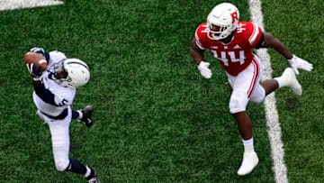 PISCATAWAY, NJ - NOVEMBER 17: Jahan Dotson #5 of the Penn State Nittany Lions grabs a reception as Tyreek Maddox-Williams #44 of the Rutgers Scarlet Knights looks on during the fourth quarter at HighPoint.com Stadium on November 17, 2018 in Piscataway, New Jersey. Penn State won 20-7. (Photo by Corey Perrine/Getty Images)