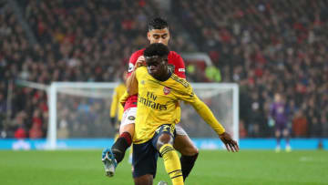 MANCHESTER, ENGLAND - SEPTEMBER 30: Bukayo Saka of Arsenal and Andreas Pereira of Manchester United during the Premier League match between Manchester United and Arsenal FC at Old Trafford on September 30, 2019 in Manchester, United Kingdom. (Photo by Catherine Ivill/Getty Images)